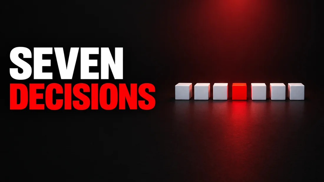 Dark cover with white SEVEN and red DECISIONS text. On the right, seven small white cubes in a row on a dark plane, the fourth one bright red, under one soft red light.