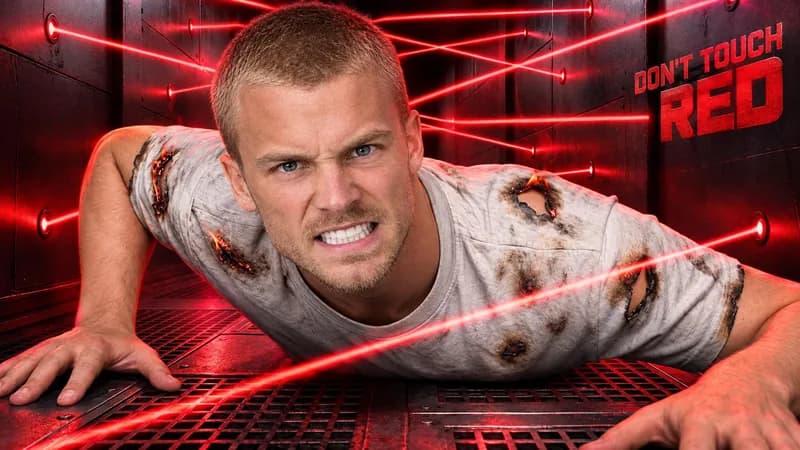 Remade by WThumb: a generated man with a buzz cut gritting his teeth under red lasers in deep red light, headline Don't Touch Red
